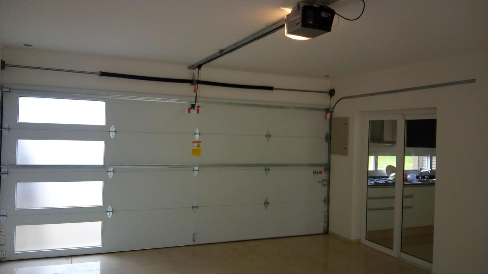 White steel garage door with windows and opener