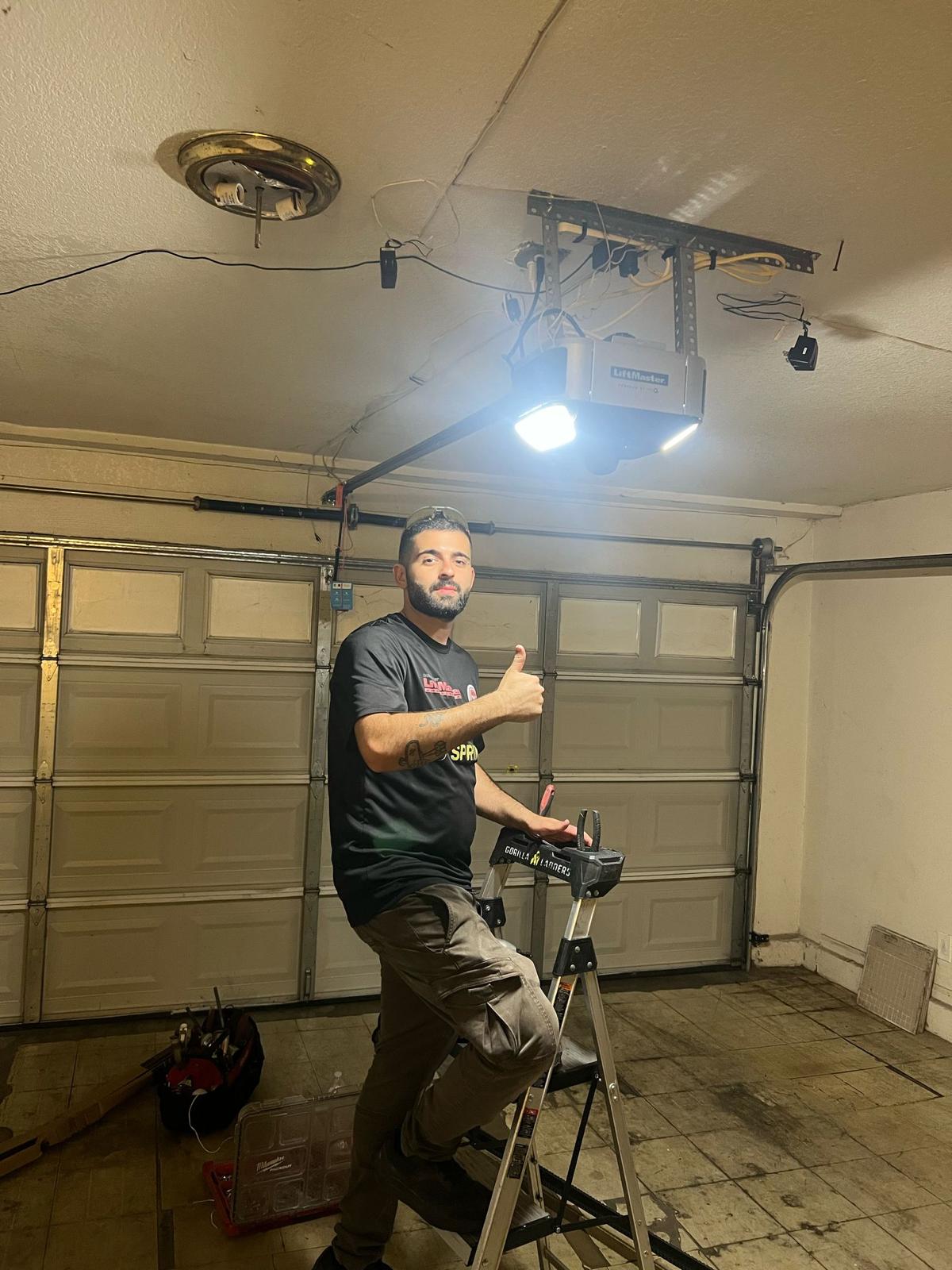United Garage Doors technician working on a residential garage door