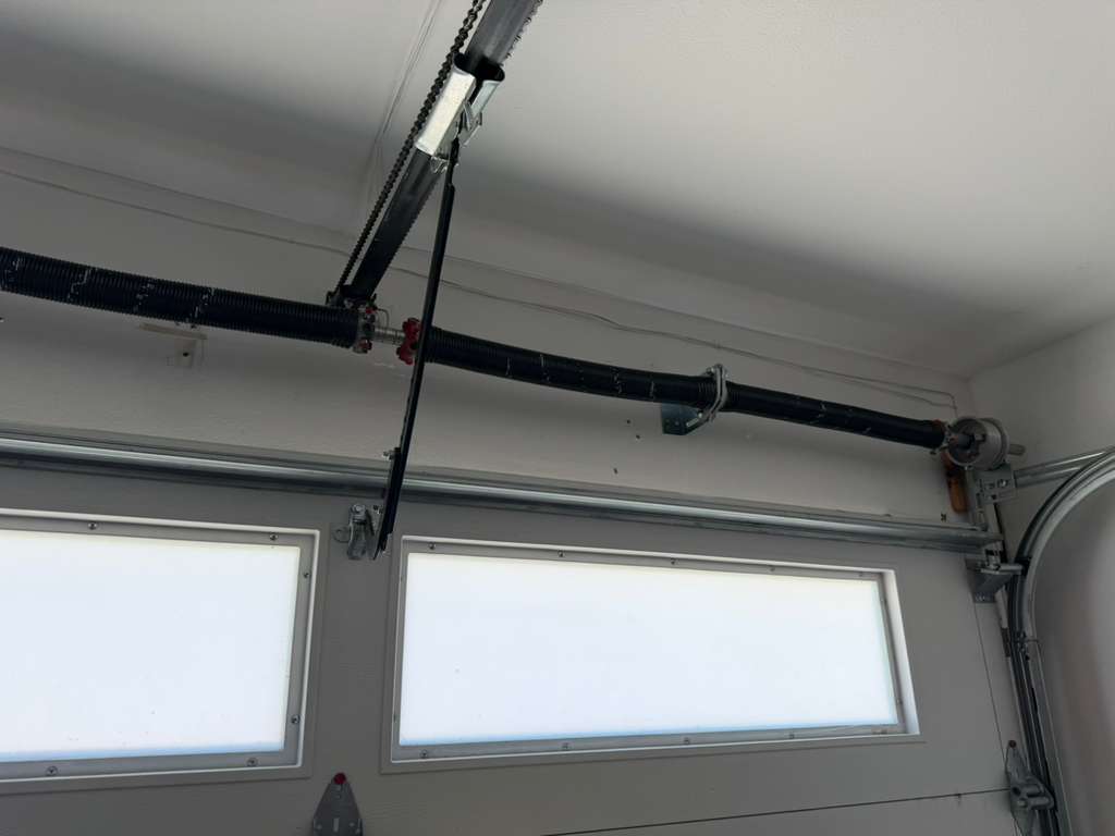 Overhead garage door track and springs